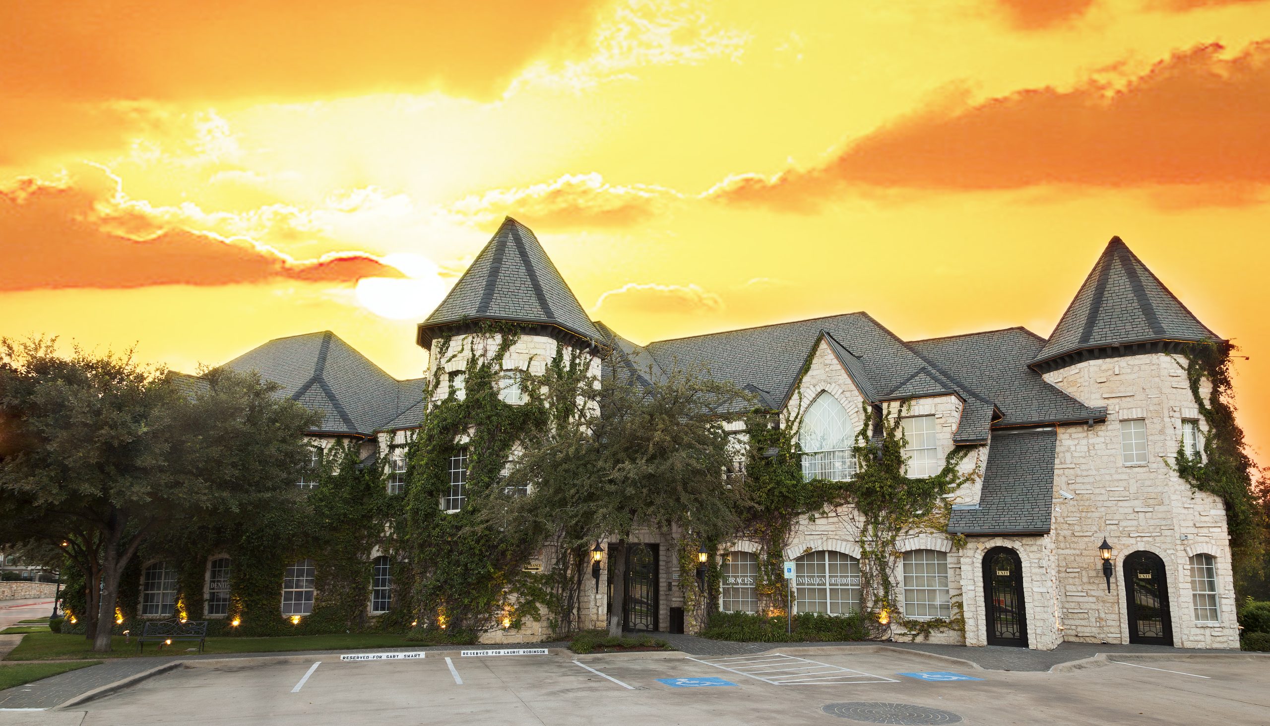 Exterior image of Celebrity Orthodontics office with ivy-covered stone building | Celebrity Ortho Dentist