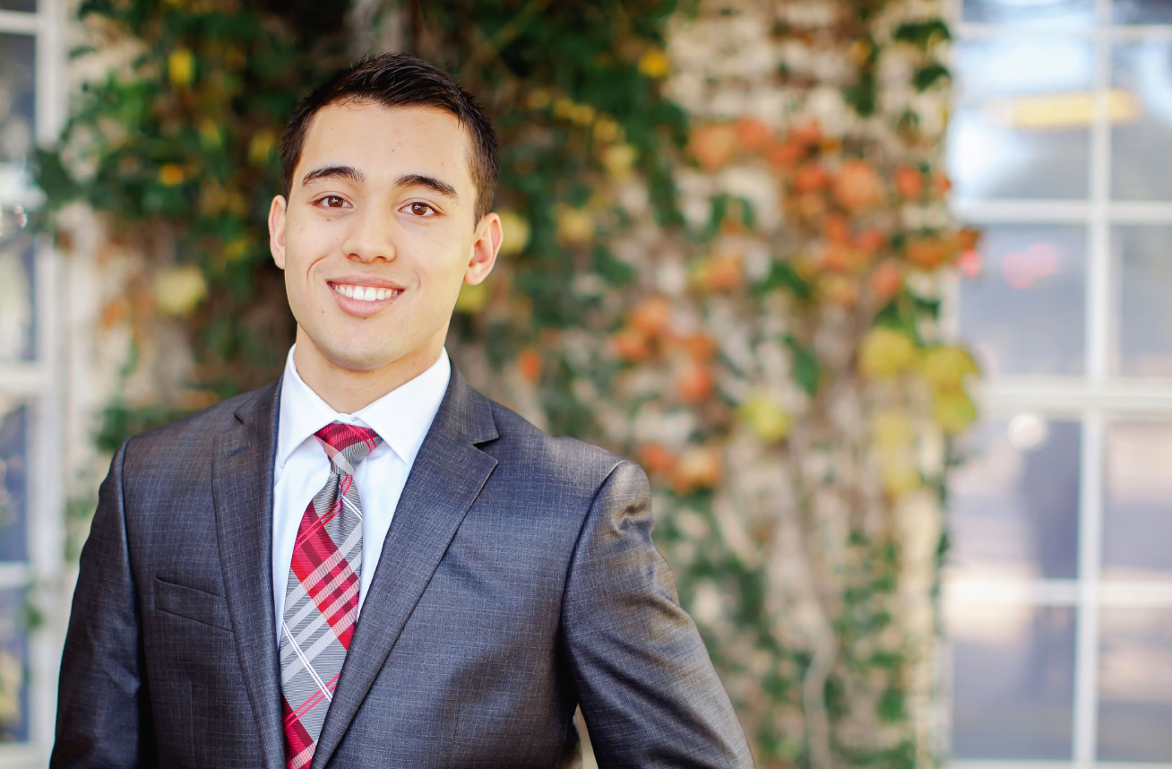 Young man smiling for photo | Celebrity Orthodontics