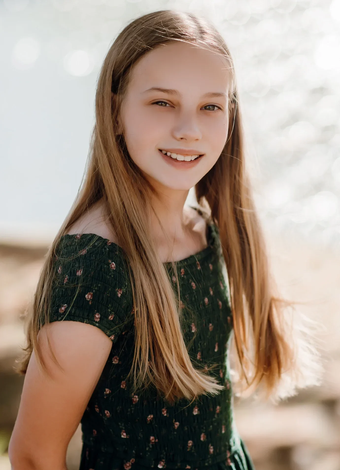 Blonde young girl with Invisalign® smiling for photo | Celebrity Orthodontics